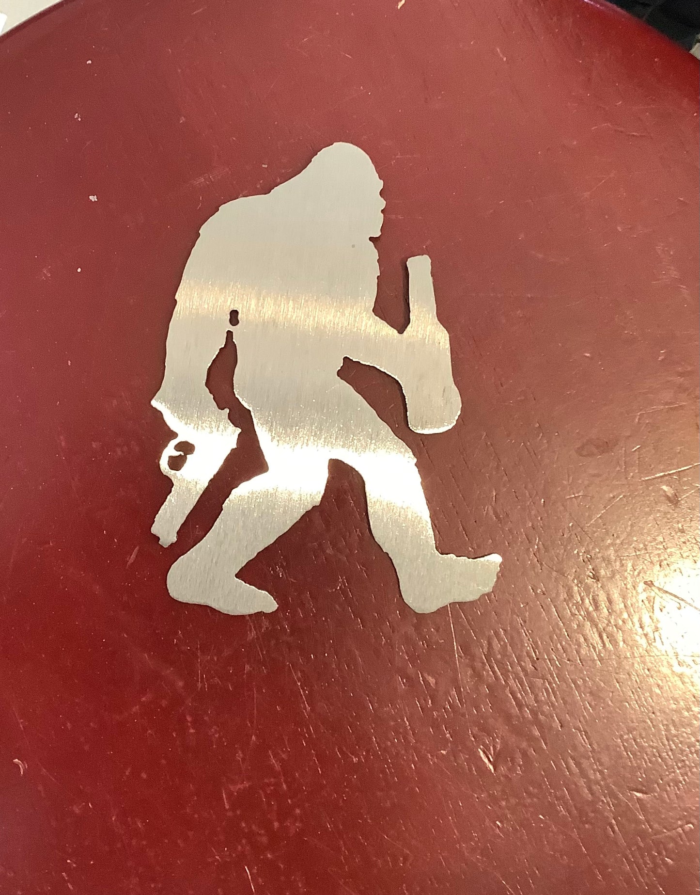 Bigfoot with gun and beer magnet metal.Cc