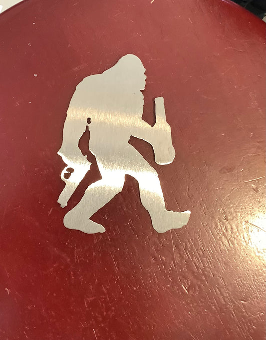 Bigfoot with gun and beer magnet metal.Cc